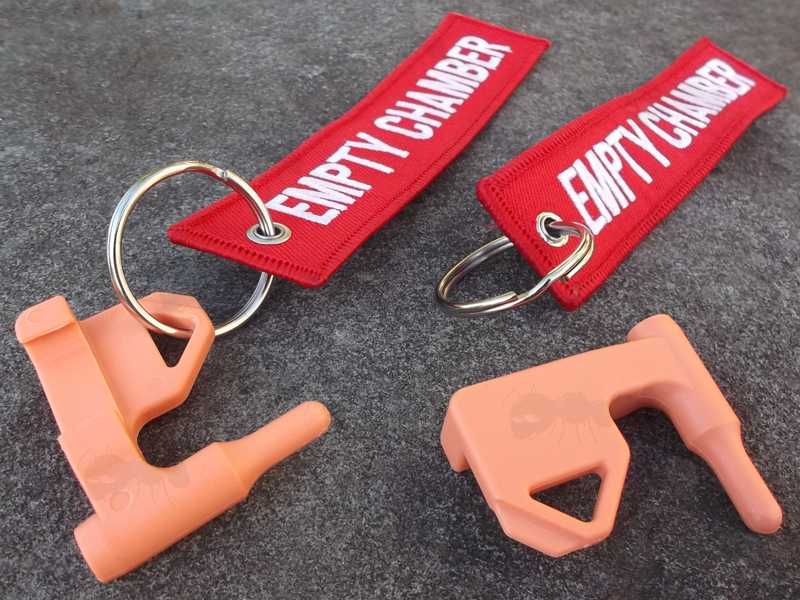 Orange Plastic Empty Gun Chamber Safety Plug Tool Fitted with Red Canvas Flag Keychain with White Embroidered Empty Chamber Text