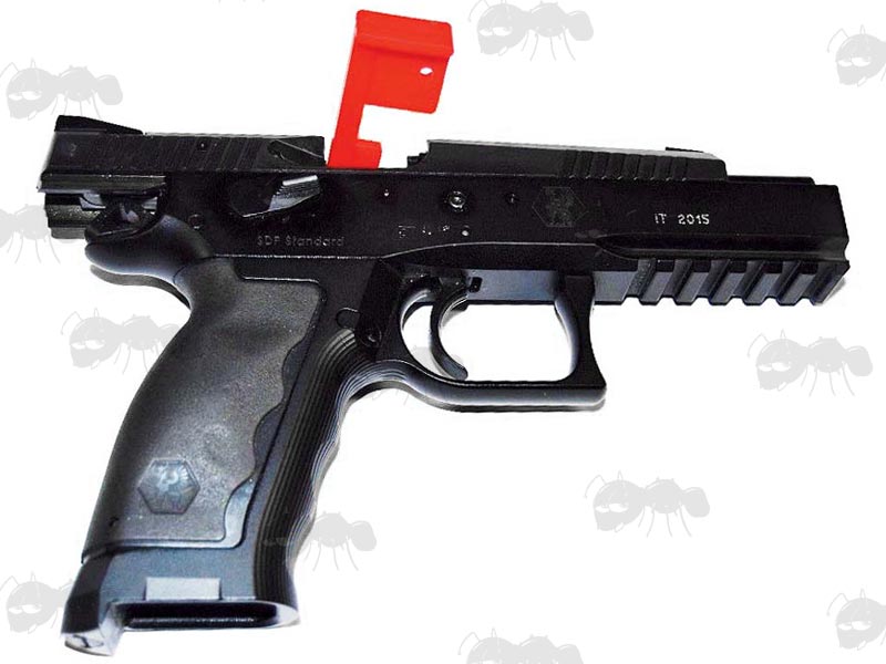 Red Plastic Safety Flag Fitted To A Pistol Ejection port