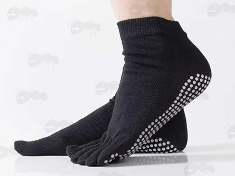 Pair of Black Yoga Non-Slip Toe Socks Being Modelled