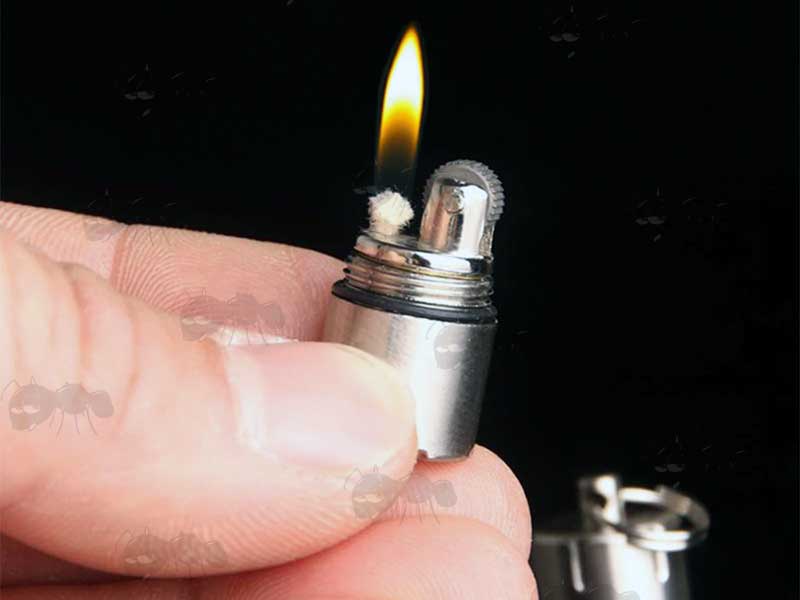 Light View of The Silver Colour Mini Capsule Oil Lighter with Flat Base and Keyring