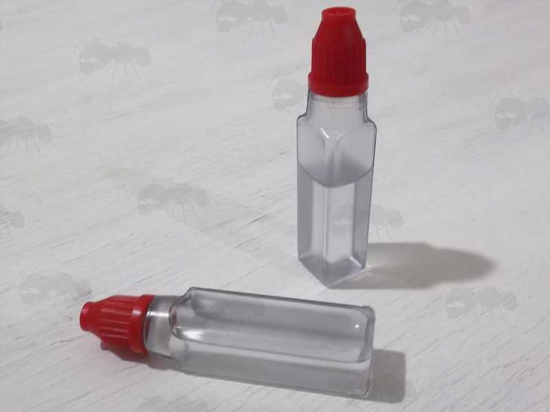 Two Mini Plastic Bottles of Lighter Oil Fluid Fuel with Red Tops