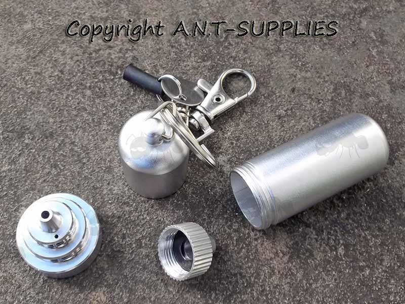 Dismantled View of The Silver Coloured Keychain Lighter Fuel Kettle