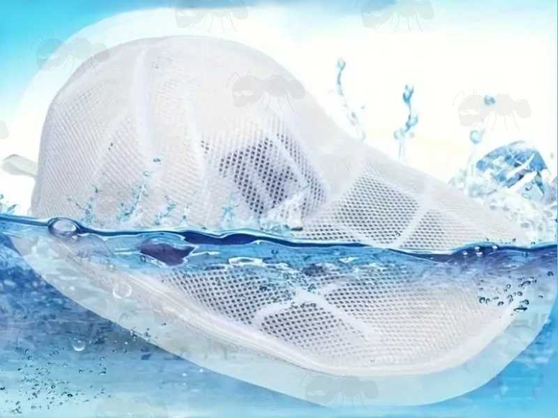 White Netting Washing Machine Bag with White Plastic Cage for Baseball Cap Cleaning, Shown in Water