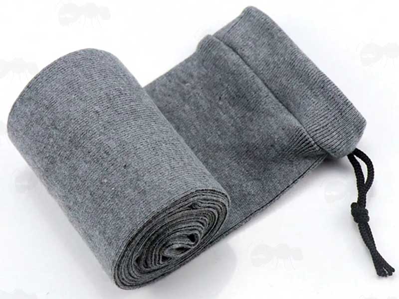 Rolled Up Grey Coloured Silicone Coated Gun Cover Sock