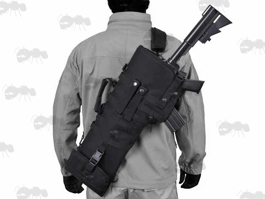 Black Canvas Tactical Rifle Scabbard With MOLLE Webbing and Detachable PAL Straps, Carry Handle and Shoulder Strap In Use