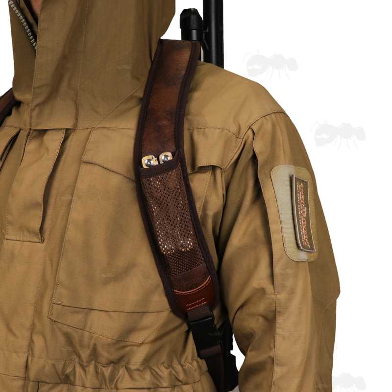 Brown TU Leather and Black Neoprene Padded Hunting Gun Back Harness Sling Fitted with Black Metal QD Swivels and Plastic Side Release Buckles, In Use with View of The Mesh Accessory Pocket