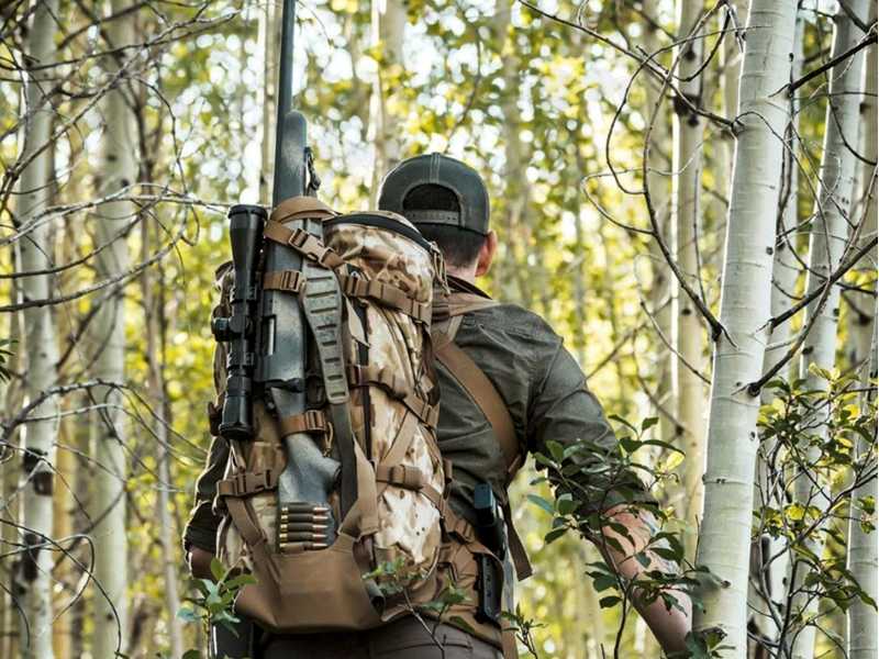 Quake Olive Drab Green Camouflage Contoured Claw Rifle / Shotgun Sling with QD Swivels, Shown Being Carried on a Rucksack