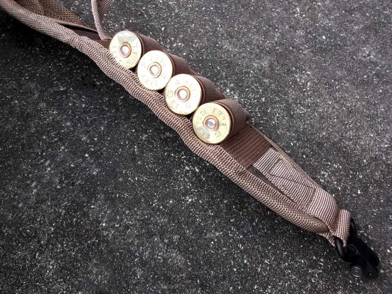 Close-Up View of 12g Sheels Attached to The Loops of The Tan and Camouflage Pattern Shotgun Sling with Mesh Pocket, Fitted with QD Stud Fitting Swivels