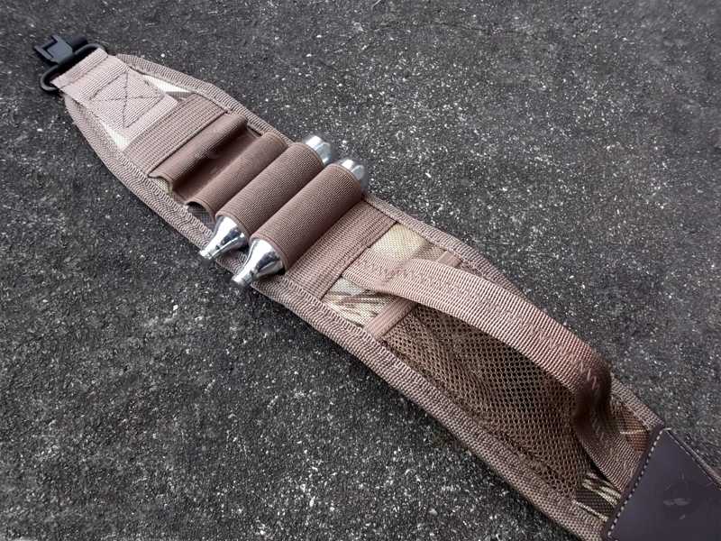 Close-Up View of Two 12g Co2 Capsules Attached to The Loops of The Tan and Camouflage Pattern Shotgun Sling with Mesh Pocket, Fitted with QD Stud Fitting Swivels