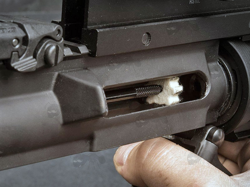 .223 AR Style Chamber Cleaning Cog Shaped Swab In Use in Rifle Chamber