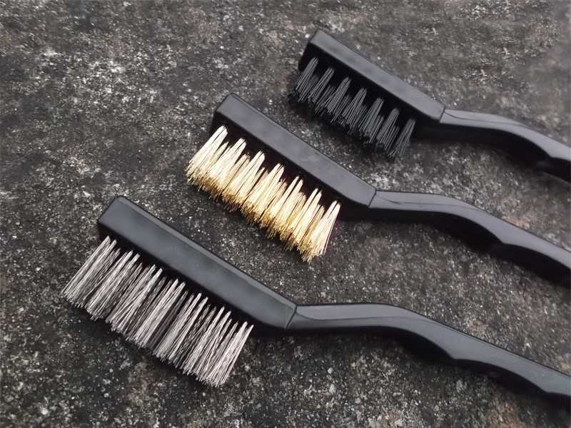 Three Gun Cleaning Brushes with Close Up View of The Angled Bristle Heads