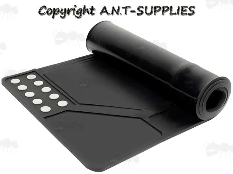 Rolled Up View of The Black Coloured Rubber Rifle / Shotgun Sized Cleaning / Maintenance Mat with Moulded Compartments for Parts and Magnetic Section