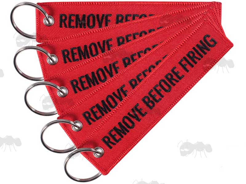 Five Red Gun Safety Keyrings with Embroidered Black Thread Remove Before Firing Text