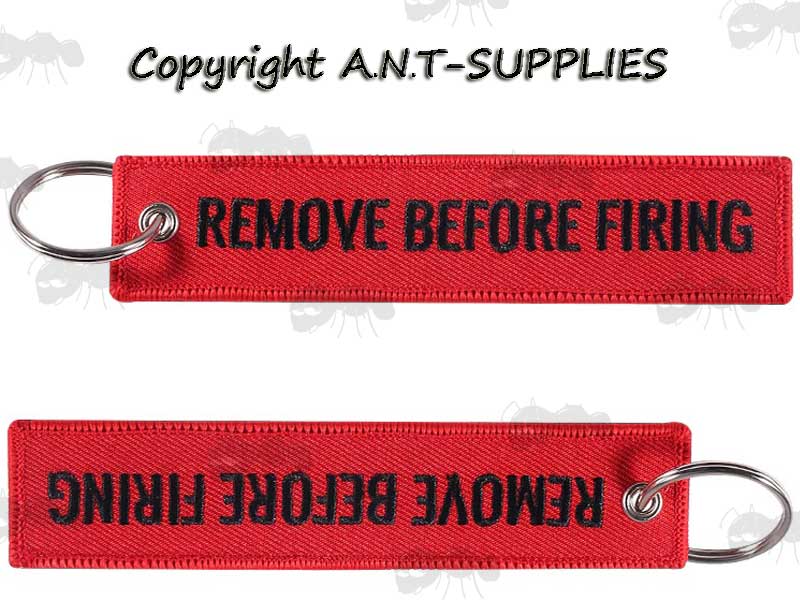 Two Red Gun Safety Keyrings with Embroidered Black Thread Remove Before Firing Text