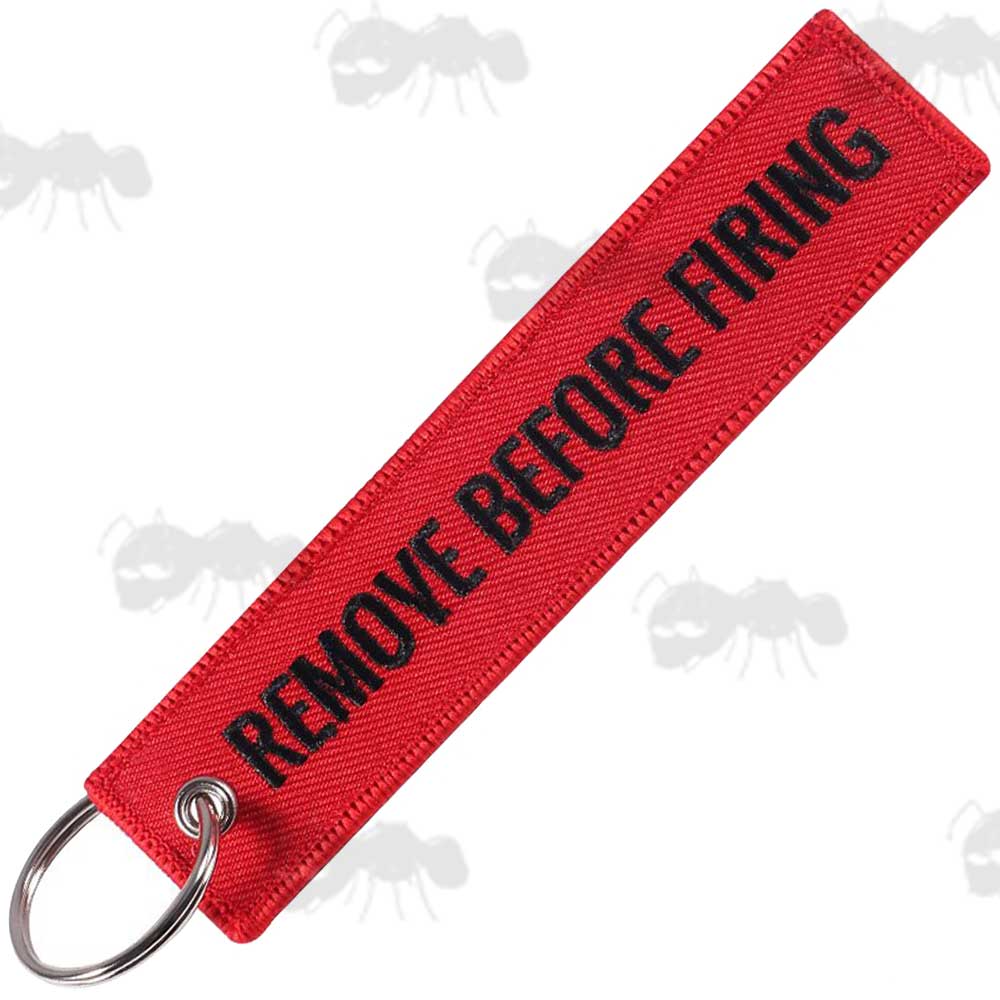 Red Gun Safety Keyrings with Embroidered Black Thread Remove Before Firing Text