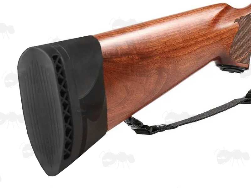 Black Rubber Ventilated Slip-On Recoil Pad for Rifle or Shotgun Butt Stocks, Shown Fitted to a Wooden Buttstock