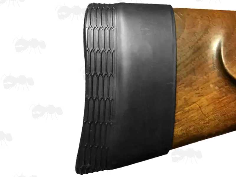 Black Silicone Rubber Slip-On Recoil Pad for Rifle or Shotgun Butt Stock, Shown Fitted to a Wooden Buttstock