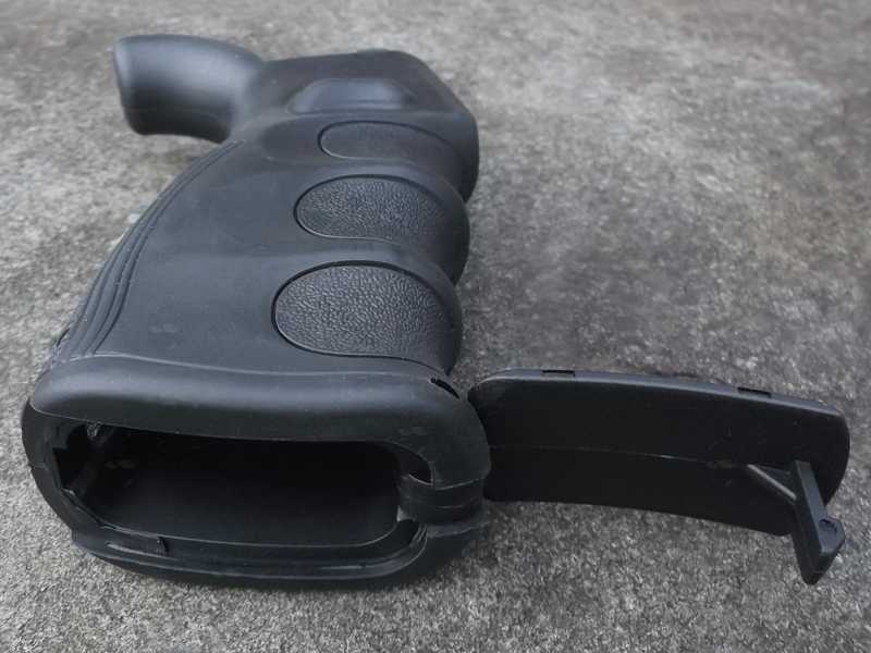 Tac Rifle Black Polymer Pistol Grip with a Oversized Finger Groove Design, Shown with Compartment Lid Hinged Open
