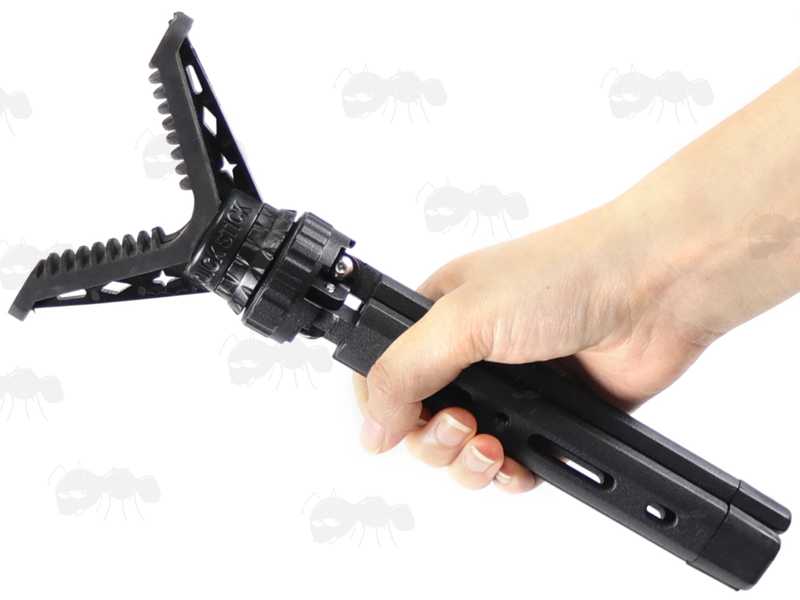 Folded View of The Compact Black Metal Tripod Benchrest Shooting Quick Stick with Removable V Notch Rest, Shown in Hand