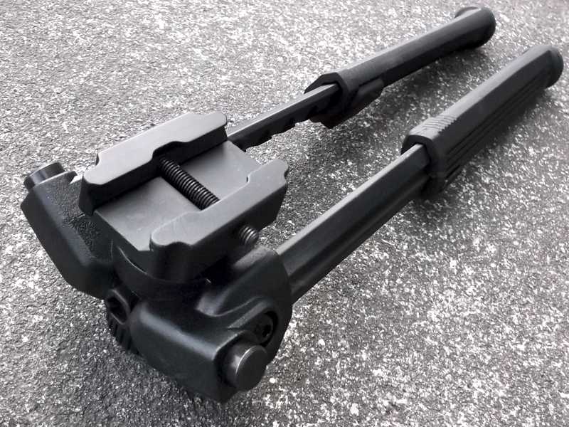 Top Rail Fitting View of The Polymer and Aluminium Design Rifle Bipod for Picatinny Handguards with Tilt Feature and 360 Degree Rotation, Shown with Legs Fully Extended