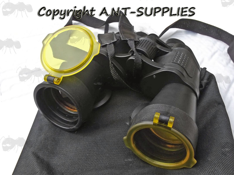 Pair of Binoculars with Quake Bushwacker Number 8 Flip-up Amber Lens Covers
