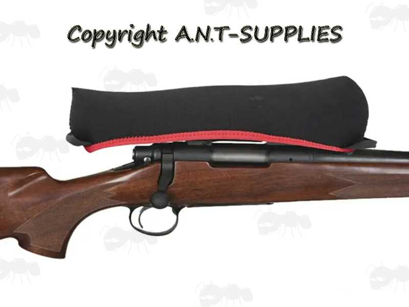 Black Neoprene Rifle Scope Cover with Red Trim Shown on Rifle