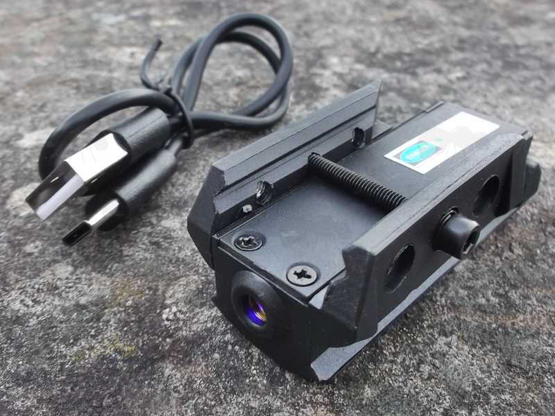 Rail Fitting View of The USB-C Rechargeable Low-Profile Black Polymer Gun Rail Mount Blue Laser Sight with Sideways Ambidextrous Stubby Power Switch, Shown with USB Charging Cable