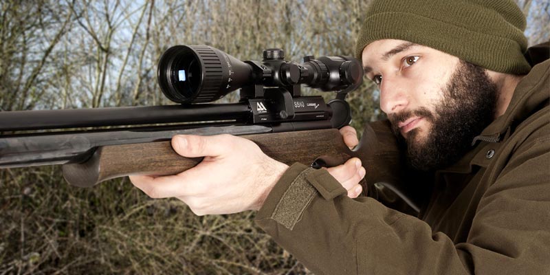 Shooter with Air Arms Rifle Using the Richter Optik 3-9x50AOE Adjustable Magnification Scope