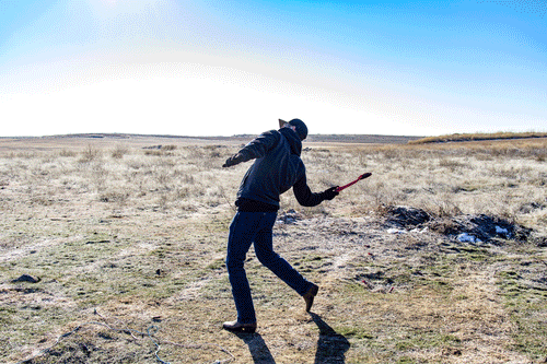The Red MTM EZ Throw Hand Powered Clay Pigeon Thrower in Use